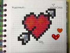 a cross stitch book with an image of a heart and two smaller hearts on it