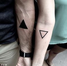 two people with matching tattoos on their arms