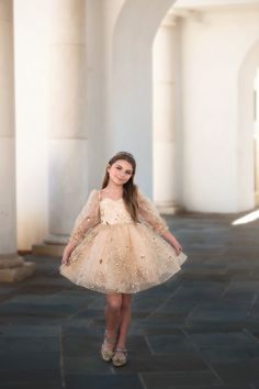 Part of our luxury collection, this dress is a stunning work of art. With it's sweetheart neckline and sparkling gold design, this dress will have all eyes on her. A lace up back and tutu pettiskirt will be perfect for the girl and her twirl! 100% poly Fully lined No glitter Machine wash, hang dry Glamorous Gold Tulle Dresses, Elegant Gold Glitter Tulle Dresses, Elegant Gold Princess Dress For Party, Elegant Fitted Gold Tutu Dress, Elegant Gold Dress For Dress-up Occasions, Elegant Gold Princess Dress With Sequins, Gold Fitted Ball Gown With Sweetheart Neckline, Gold Fitted Princess Dress For Pageants, Gold Sequined Princess Dress For Wedding