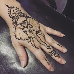 a hand with an elephant drawn on it