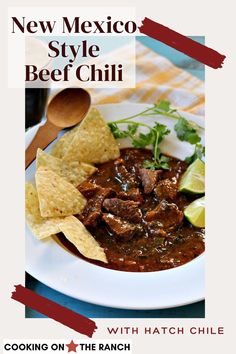 a white plate topped with beef and tortilla chips