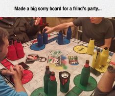 a group of men sitting around a table playing a game with beer bottles on it