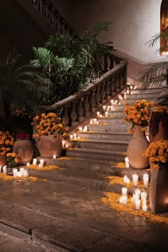 flowers and candles are lit on the steps