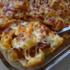 a casserole dish with cheese and meat on it, ready to be eaten