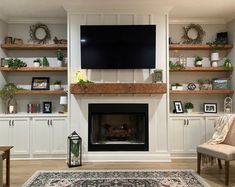 a living room filled with furniture and a flat screen tv mounted on the wall above a fireplace