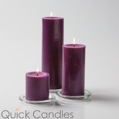 three black candles sitting next to each other