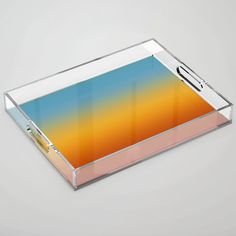 an acrylic tray with a pen on it