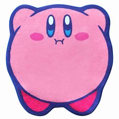 a pink and blue animal shaped rug with eyes