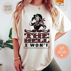 If you're looking for a thoughtful and practical gift, our apparel is sure to be appreciated by anyone who receives it. These western tshirts are handmade to order on an ultra-soft shirt that will quickly become your go-to apparel item! Our trendy cowgirl tees are made with eco-friendly water-based ink that feels good and lasts longer! You will never want to take it off! ♥Sizing info♥ *Unisex sizing. *Order your true size for a more fitted feel. Size up for a slouchier look ♥Care Instructions♥ *Wash on cold *Hang dry or tumble dry on low heat *Non-chlorine bleach only *Do not iron directly on the design ♥Shipping♥ 🚚Every order (no matter how large) ships same or next business day! We want you to receive your garment as quickly as you can so you can start enjoying it! 📦Free shipping ♥How Cotton Top With Funny Text For Fan Merchandise, White Tops With Funny Text For Fans, Cotton Tops With Funny Text For Fan Merchandise, Custom Print Ring-spun Cotton Tops For Fan Merchandise, Fan Merchandise Custom Print Ring-spun Cotton Top, Western Tshirts, Cowgirl Graphic Tees, Western Style Relaxed Fit T-shirt With Graphic Print, Country Girl Gifts