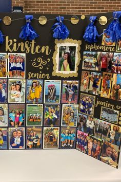 a bulletin board with pictures and blue tassels