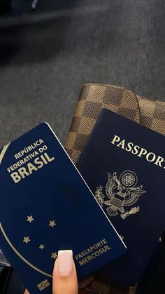 a person holding a passport in their hand