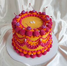 a cake decorated with pink and orange icing