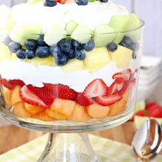 a layered fruit salad in a glass dish