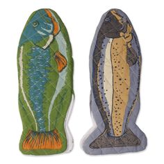 two fish shaped magnets sitting next to each other