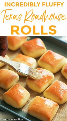 a pan filled with rolls covered in orange icing next to a wooden spatula and text overlay that reads incredibly fluffy texas roadhouse rolls