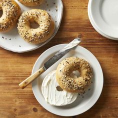 three donuts sitting on top of white plates