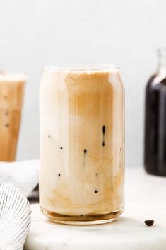 a jar filled with liquid sitting on top of a counter