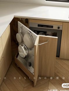 an open cabinet with pots and pans in it