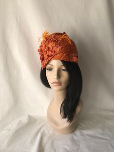 "This is a burnt orange Swarovski Crystal with flower pleated Formal hat for Women's Elegant designer COGIC church hat, Ladies Tea Party hat, wedding hat or any other special occasion. Fits 23.5\"-24\" Worn on both sides Pleated straw with hand curled ostrich feathers." Orange Curved Brim Hat For Spring, Orange Fitted Headpiece For Kentucky Derby, Orange Short Brim Hat For Spring, Adjustable Orange Mini Hats For Party, Orange Headpiece For Kentucky Derby Races, Orange Headpieces For Kentucky Derby Races, Orange Fascinator For Spring Races, Orange Headpieces For Party At Royal Ascot, Orange Spring Fascinator For Races