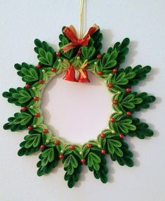 a christmas wreath ornament hanging on a wall