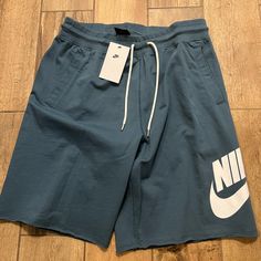 The Nike Sportswear Shorts Feature Unfinished Hems And A Ribbed Waist With Drawcord For A Vintage Vibe. French Terry Cotton Delivers A Soft Touch And Everyday Durability. Shown: Midnight Navy/White Style: At5267-410 Summer Sports Sweatpants With Drawstring, Summer Sports Joggers With Drawstring, Blue Sporty Sweatpants With Drawstring, Sporty Blue Joggers With Drawstring, Sporty Blue Sweatpants With Drawstring, Nike Cotton Pants With Moisture-wicking, Nike Short Bottoms For Sports, Comfortable Nike Cotton Bottoms, Cotton Sports Bottoms