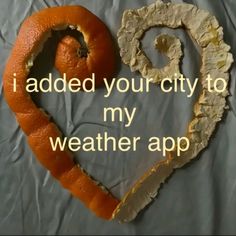 an orange is in the shape of a heart and has words written on it that read i added your city to my weatherapp