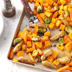 roasted vegetables on a baking sheet ready to be cooked