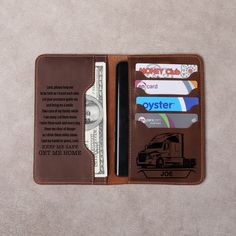 a wallet with a credit card holder and money clip attached to the front, sitting on top of a carpeted floor