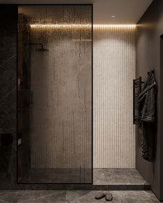 a walk in shower sitting inside of a bathroom next to a wall mounted towel dispenser