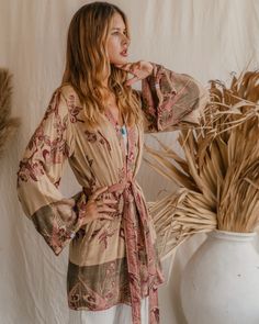 Our Short Kimono offers an easy, relaxed fit, combining comfort with understated elegance. Its fluid silhouette adds a touch of effortless charm to any outfit, making it a versatile piece for both casual days and special moments. Made from eco-friendly LENZING™ Modal. Good for body and earth 🌱 Chic Fall Kimono For Daywear, Chic Fall Kimono For Loungewear, Chic Fall Loungewear Kimono, Fall V-neck Kimono For Daywear, V-neck Kimono For Fall Daywear, Casual Beige Kimono For Loungewear, Fall Kimono With Relaxed Fit For Loungewear, Flowy Long Sleeve Kimono For Day Out, Chic Spring Loungewear Kimono