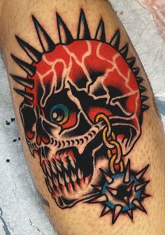 a skull with spikes on it's head is shown in this tattoo style photo