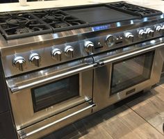 a stainless steel stove and oven in a kitchen