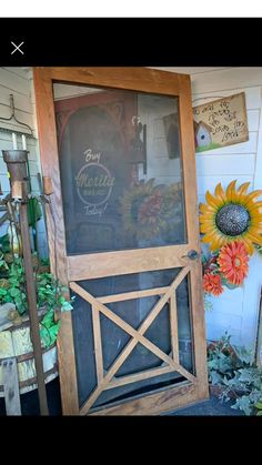 an old wooden door with a sign on the front and side glass that says, don't worry