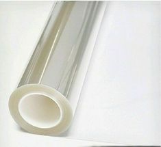 a roll of clear tape sitting on top of a white table