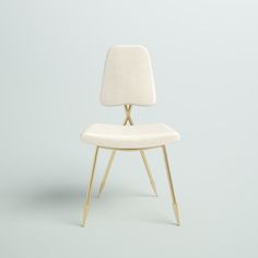 a white chair sitting on top of a wooden floor next to a wall with a light blue background