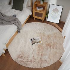 a bedroom with a round rug on the floor