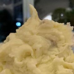 a scoop of mashed potatoes sitting on top of a table