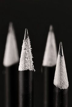 three pencils with some writing on them and one is written in two different languages