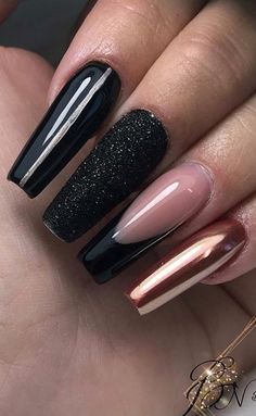 24 Gorgeous Rose Gold Nail Designs will have your mouth watering. From a simple gold nail with a hint of glitter, to a metallic rose design that is perfect for the upcoming holiday season. This post showcases some of the best designs from around the internet with photo of completed designs. #rosegoldnails #rosegoldnailart #rosegoldnaildesigns #rosegoldacrylicnails Black And Rose Gold Sparkle Nails, Rose Gold And Black Nail Ideas, Black Chrome And Glitter Nails, Bronze Nails Designs Rose Gold, Black And Rose Gold Nails Acrylic, Nails Black And Rose Gold, Black Rose Gold Nails, Rose Gold Chrome Nails Designs, Black And Rose Gold Nail Designs