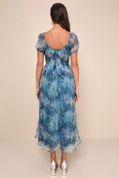 Let the romantic vibes of the Lulus Lovely Statement Teal Blue Floral Organza Tie-Back Midi Dress make you feel effortlessly flirty for any special occasion! Airy woven organza, with a blue and green floral design throughout, shapes this gorgeous dress that features a princess-seamed bodice, a sweetheart neckline with a notched detail and supportive V-bar, and sheer puff sleeves (with elastic at the shoulders and cuffs). The high, fitted waist tops a twirl-worthy, skater-style skirt that finishe Blue Silk Chiffon Summer Dress, Organza Dress With Floral Print For Evening, Feminine Blue Silk Dress, Fitted Silk Chiffon Dress For Wedding Guest, Blue Silk Chiffon Dress, Elegant Blue Silk Chiffon Dress, Fitted Silk Chiffon Dress For Garden Party, Blue Organza Dress For Wedding Guest, Blue Silk Dress For Garden Party