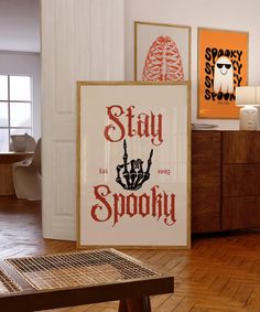 there is a sign that says stay spooky on the wall in this room