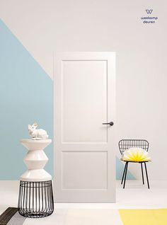 a white door and chair in a room