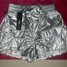 Fashion Nova Size Xs Silver Shorts New With Tag Two Front Cargo Style Pockets, Two Rear Pockets Example Photos Not Actual Shorts In These Photos;Last 3 Images To Show Ways To Style Silver Metallic Shorts For Ideas Summer Shorts With Pockets For Night Out, Casual Pants For Night Out, Casual Shorts With Pockets For Night Out, Fashion Nova Shorts, Metallic Shorts, Silver Shorts, Grey Trench Coat, Two Piece Short Set, Shorts Fashion