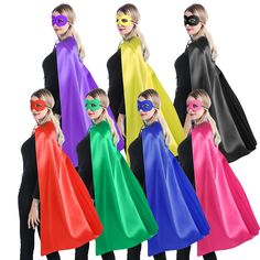 six children wearing different colored capes and masks, all standing in the same row