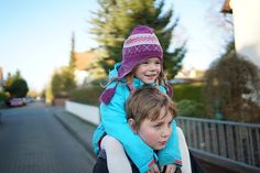 two children sitting on the back of a motorcycle