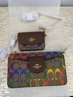 Luxury Multicolor Wallets For Travel, Designer Multicolor Travel Wallet, Coach Bags With Card Slots For Travel, Coach Travel Bag With Card Slots, Coach Crossbody Wallet With Removable Pouch, Signature Canvas, Chain Strap, Card Case, Smooth Leather