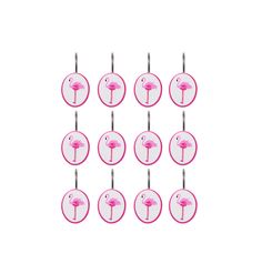 twelve pink flamingos are arranged in the shape of small round discs on a white background