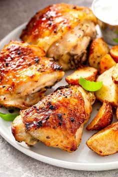 the best roasted chicken extra juicy with tons of flavor is served on a white plate