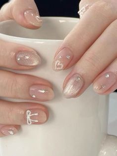 a shiny jelly type coloring with hearts and bow rhinestones, short nails Saranghae Nails, Coquette Gel Nails, Korean Nails Charms, Korean Gel Nails Simple, Nail Art Korean Style Trends, Nail Korean Style Cute, Nail Cute Korean, Korean Nail Ideas, Nail Ideas Korean