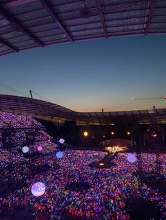 the lights in the stadium are glowing brightly